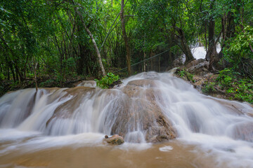 Waterfall scene at Pha Tad Waterfalls in rainforest  at the Khuean Srinagarindra National Park Kanchanaburi.