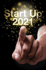 Start Up 2021 with hand.