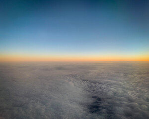 Fototapeta na wymiar Sunset just past the horizon viewed from an airplane