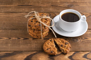 a cup of coffee and homemade cookies with chocolate