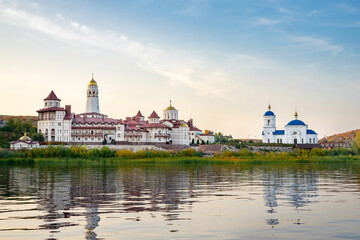Obraz premium View of the Church of the Holy Theotokos of Kazan Monastery in the village of Vinnovka, on the banks of the river Volga, Samara region, Russia