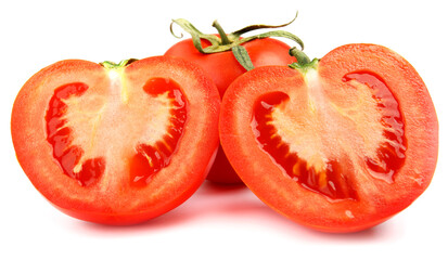 A whole red tomato cut into two halves is isolated on a white background.