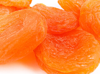 Dried apricots close-up on a white background.