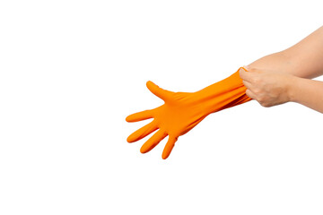 Women's hands putting on the protective orange rubber gloves isolated on white background