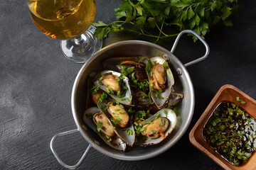 Classic French meal Moules marinière  Marinara mussels with garlic, sauce, lemon and parsley. 