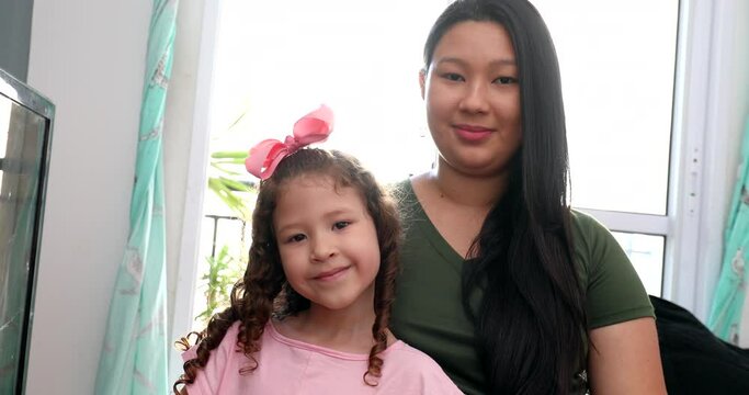 Diverse mother and daughter portaits, asian mom and mixed race kid
