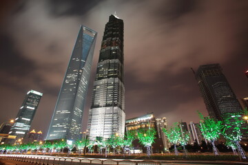 Night view of Shanghai Finance and Trade district Pudong Lujiazui skyscrapers with  Jin Mao Tower and  Shanghai World Financial Center in Shanghai, China.