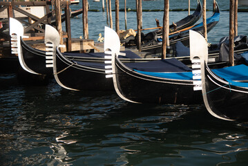 Fototapeta na wymiar Venice Gondolas moored at the San Marco square or Piazza san Marco,