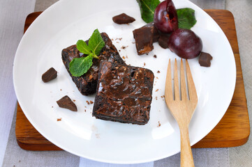 Fudge Brownie Bars on White Plate with Wooden Fork
