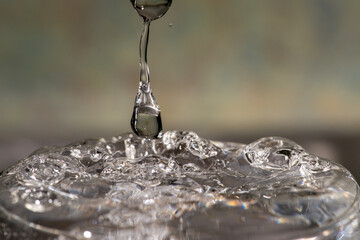 water flowing into a glass