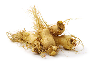 Fresh ginseng slices on white background.