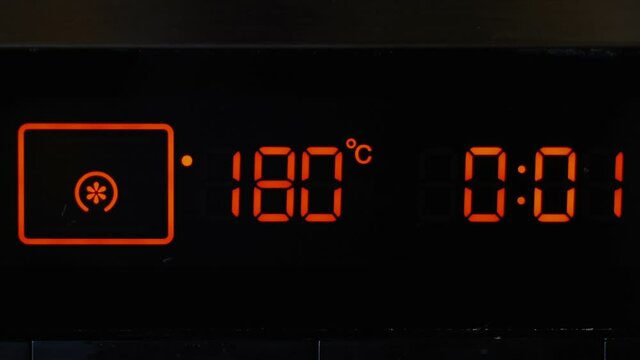 Close-up, touch panel of an electric oven. Temperature control and timer on the oven panel.