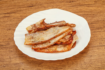 Roasted juicy bacon in the plate
