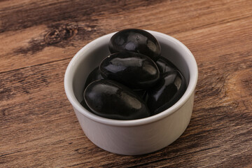 Pickled black olives in the bowl
