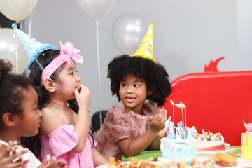 Happy birthday party event, group of adorable kids celebrate birthday party together, happy...