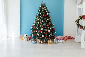 Christmas tree with gifts blue decor new year interior