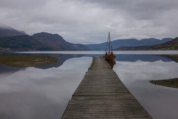 viking ship in gorgeous fjord landscape in Norway