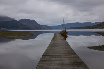 Fototapeta premium viking ship in gorgeous fjord landscape in Norway