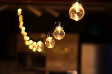 Christmas garland with golden lamps. Edison chandelier for the holiday. Cozy lights. High quality...