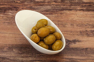 Green pickled olives in the bowl