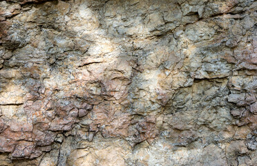 Natural mountain stone,a section of rock texture on a Sunny day.