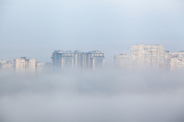 Highrise residential buildings in the fog in morning