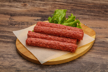Raw beef sausages with spices