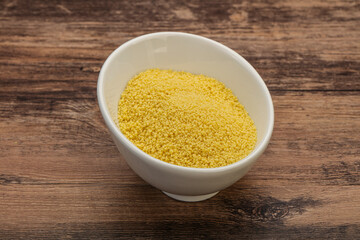 Raw cous cous heap in the bowl