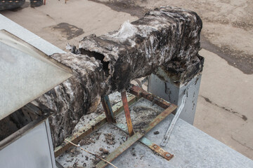 burnt-out insulation of the ventilation duct from the barbecue and the induction motor on the roof...
