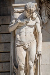 Obraz premium Statue of powerful and emotional atlas of Renaissance Era as support for building facade in Dresden, Germany, details, closeup