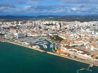 Fototapeta na wymiar Aerial view of the city of Faro at the beautiful Algarve coast, in Portugal seen on a flight to Faro