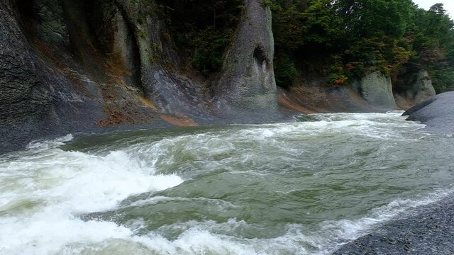 A slow motion of a large water stream that flows noisily in a huge rocky environment, Fukiware Falls is often called "Japan's version of Niagara Falls", next to Numata, near Nikko National Park, Japan