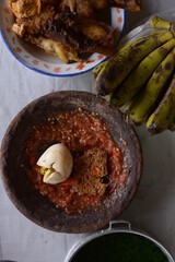salted egg and hot chili sauce in the mortar