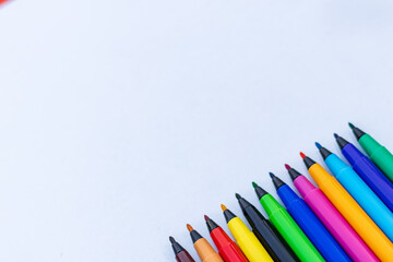 Colorful sketch pen on a whiteboard at school with copyspace.