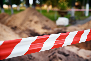 Red and white barrier tape protect danger place