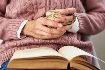 Woman sitting and reading a book. Relaxing concept