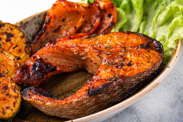 Grilled salmon steak with vegetables