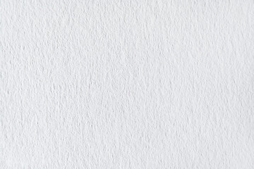 Grainy white paper surface as texture, background (close up, macro)
