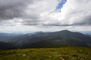 Beautiful low clouds over the mountains. Mountain landscape.