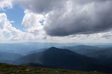 Thunderclouds on the top of the mountain before the rain. Weather conditions.
