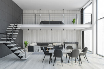 Living room with black chairs and table, two floors with step hall illustration