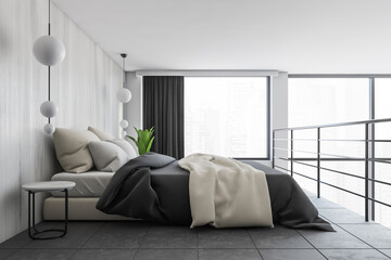 Bed on the second floor with linens, grey and white minimalist sleeping room