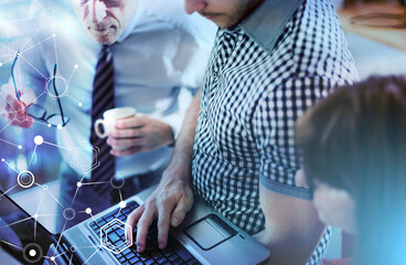 Business people in meeting working on laptop; light effect