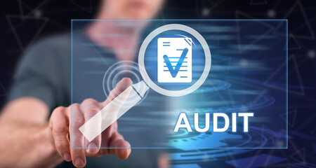 Man touching an audit concept
