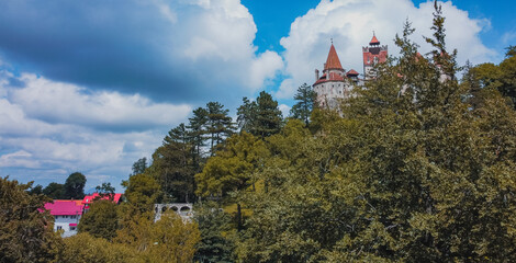 Aerial view of Bran castle or famous Dracula's castle, close to Bran, Romania on a cloudy summer day.