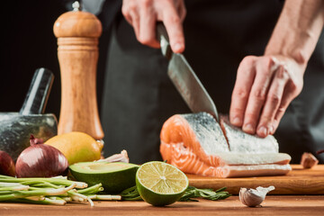 Half of lime laying among different ingredients on table