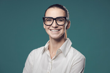 Smiling young businesswoman with glasses