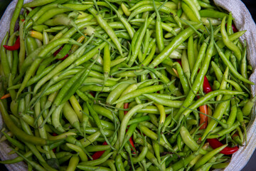 top view, fresh vegetables standing in sack at market place.