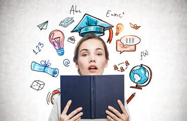 Astonished woman with book and education sketch