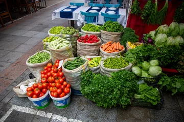 Fotobehang top view, fresh vegetables standing in sack at market place. © bahadirbermekphoto